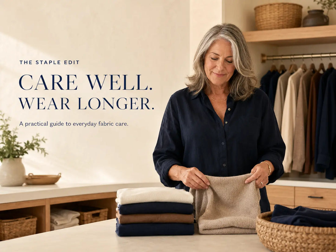 Mature woman caring for everyday clothes in a bright, organized laundry and dressing space.