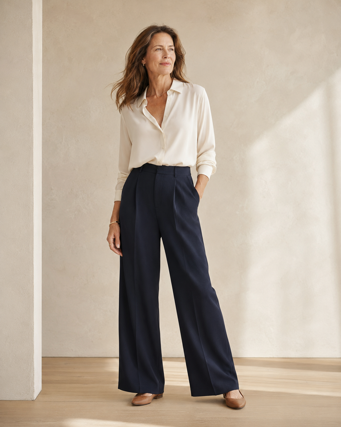 STAPLE Bottoms collection — woman in navy wide-leg trousers