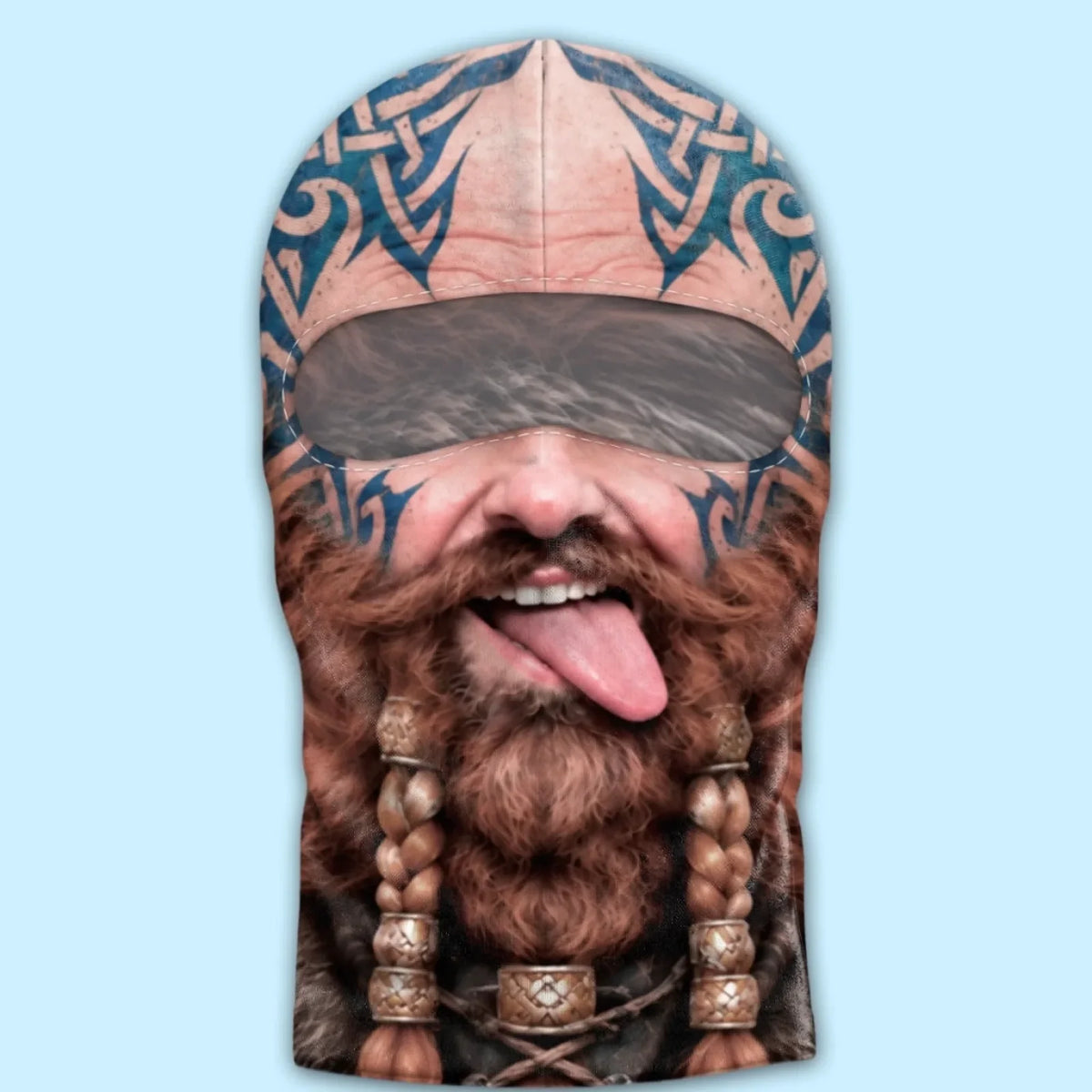 Viking braided-beard print balaclava laid flat, showing the eye opening and fixed blue tattoo design.