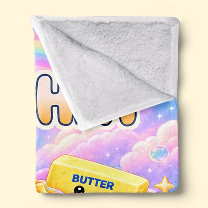 Folded rainbow name blanket showing textured white reverse