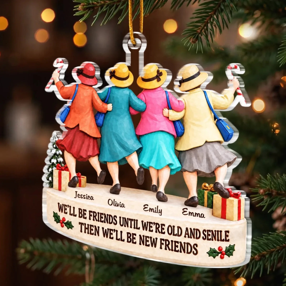 Four-friends ornament hanging from a Christmas tree