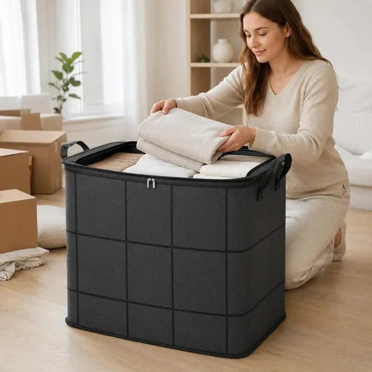 Dark gray zippered storage bag holding folded bedding