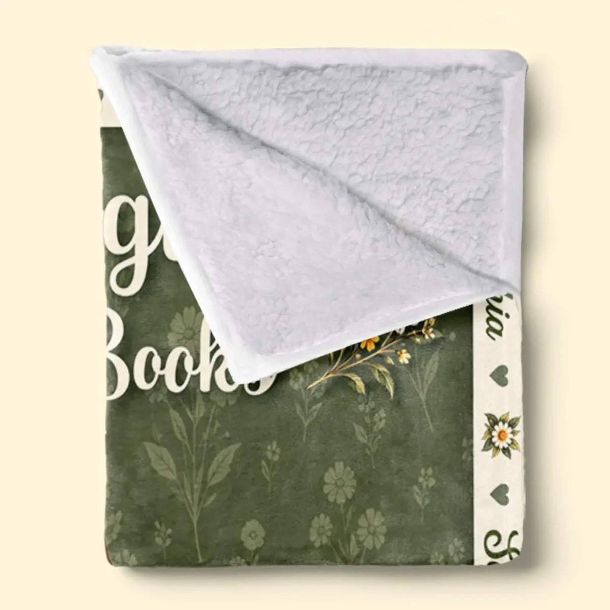 Folded floral storytime blanket showing white textured Sherpa backing