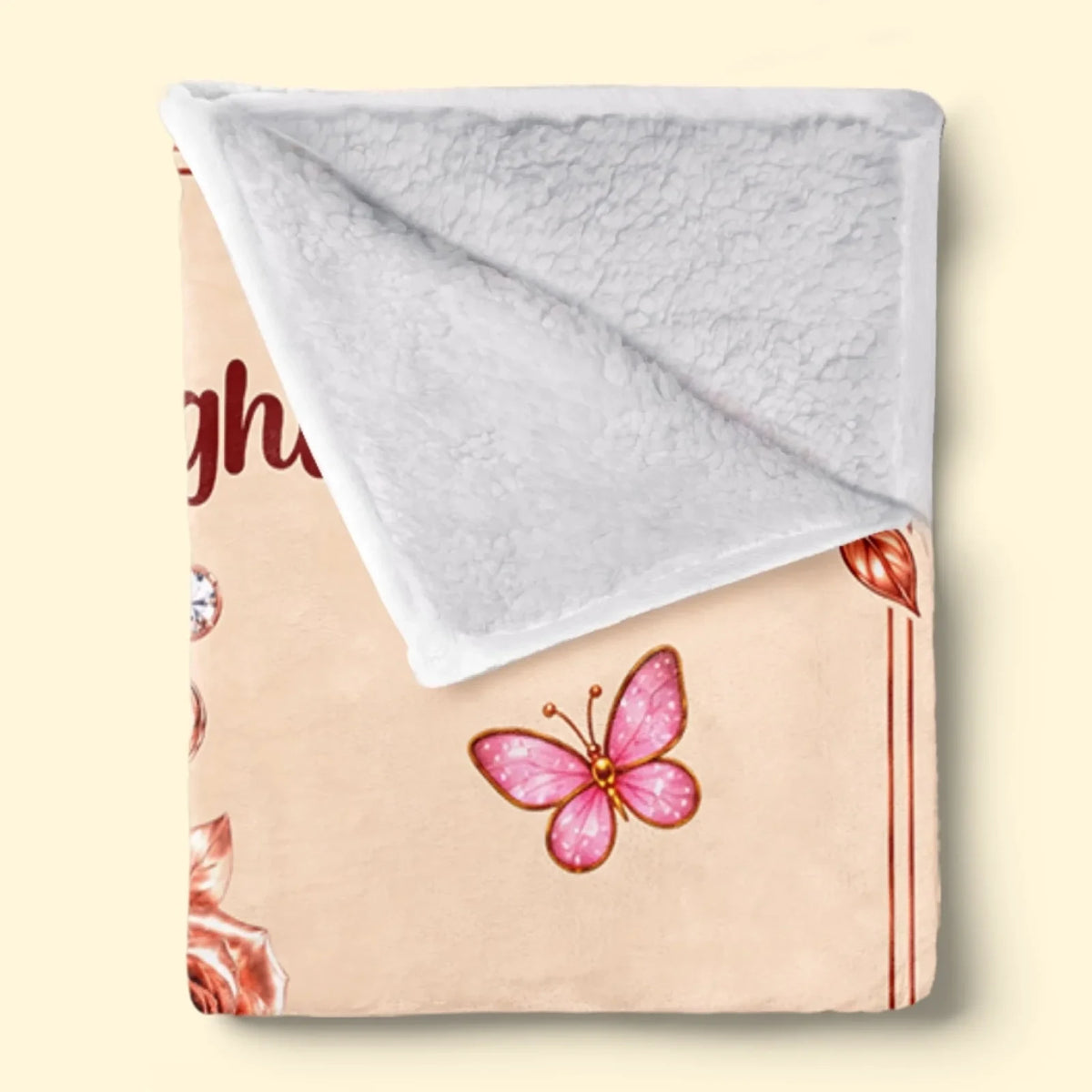 Folded Floral Love initial blanket showing white textured Sherpa backing