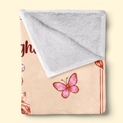 Folded Floral Love initial blanket showing white textured Sherpa backing