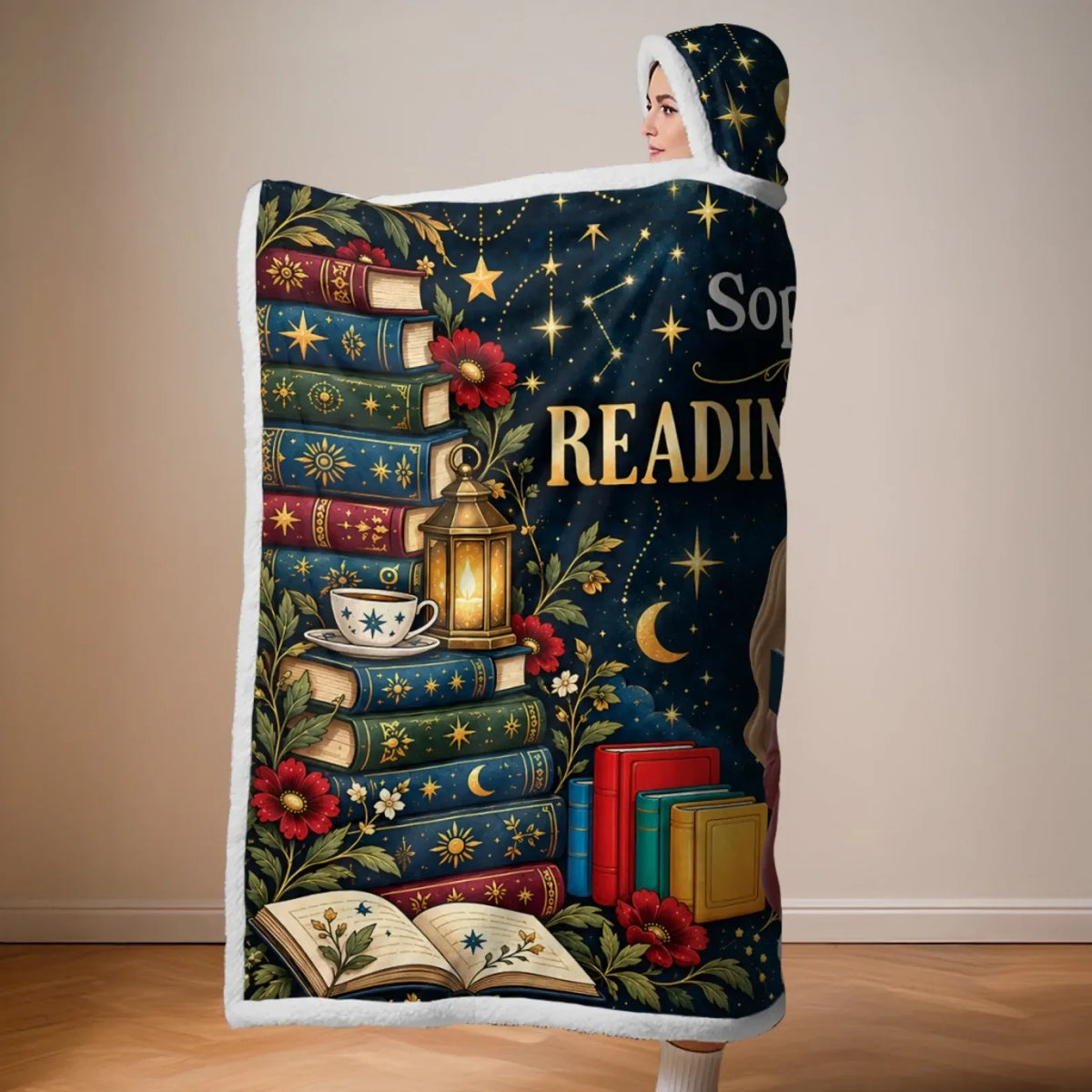 Side view of reading snuggle blanket showing books, flowers, moons and custom name