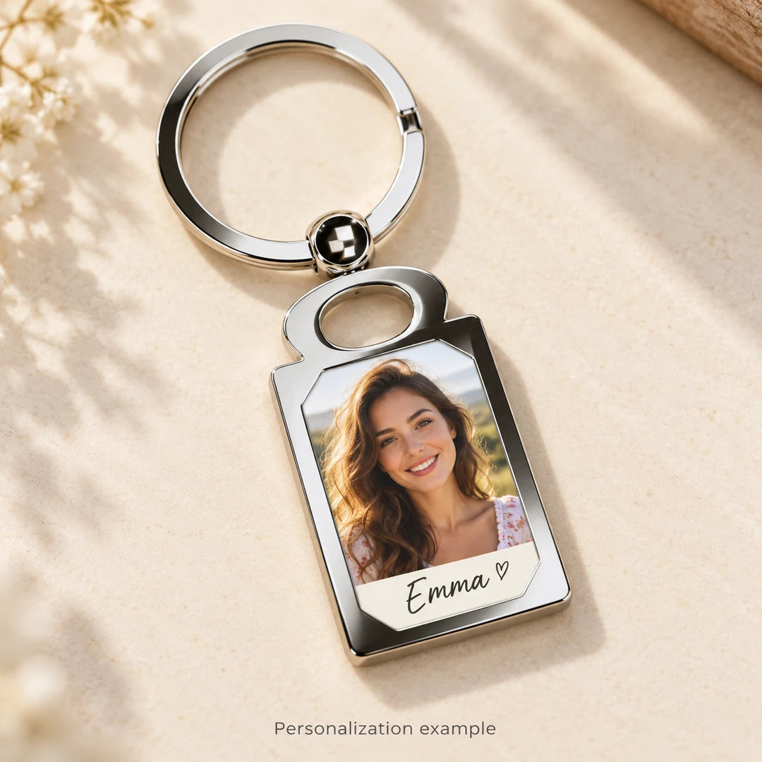 Illustrative personalized photo keychain studio mockup with fictional portrait and sample name Emma