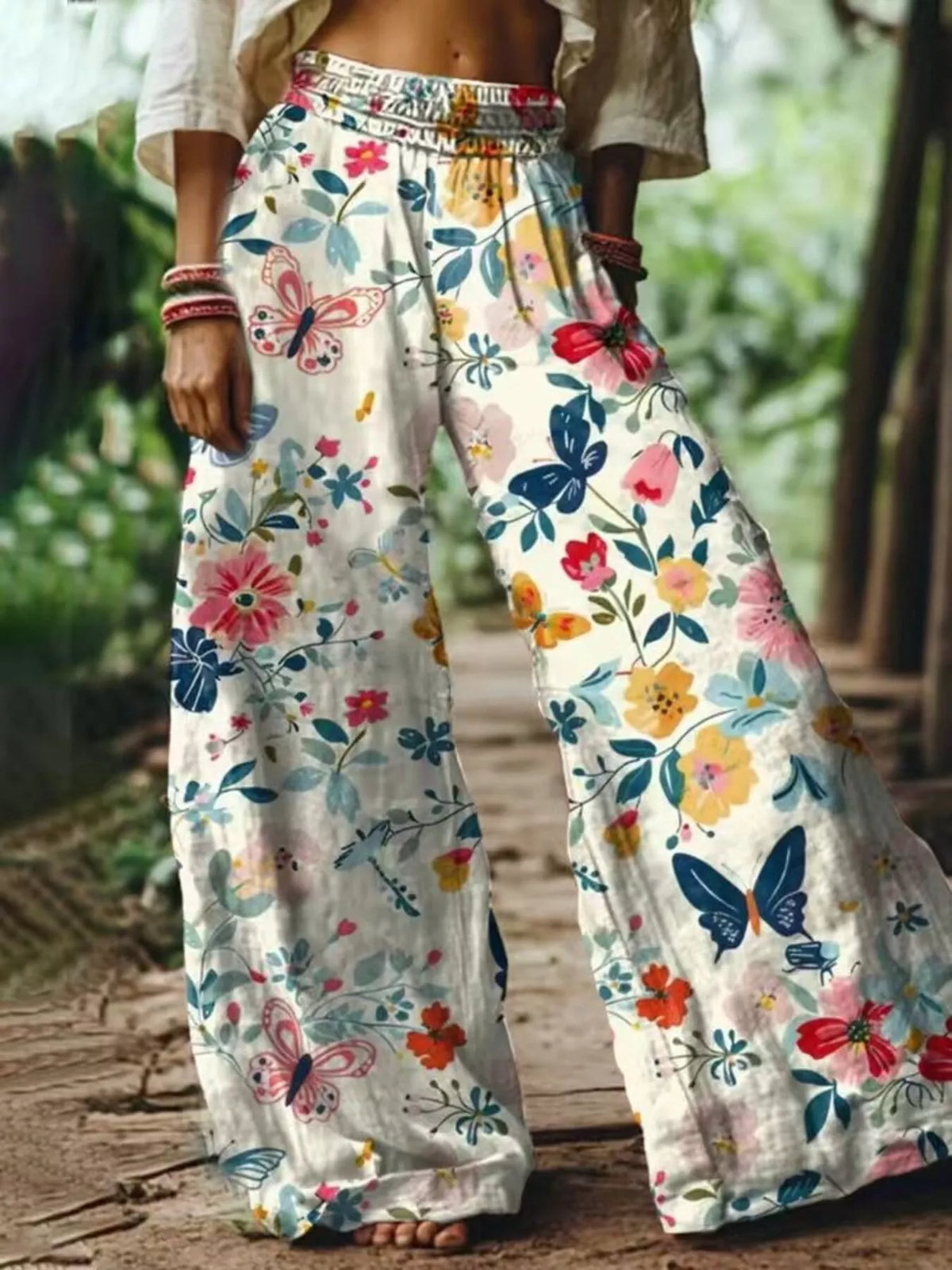 White floral wide-leg pants on model