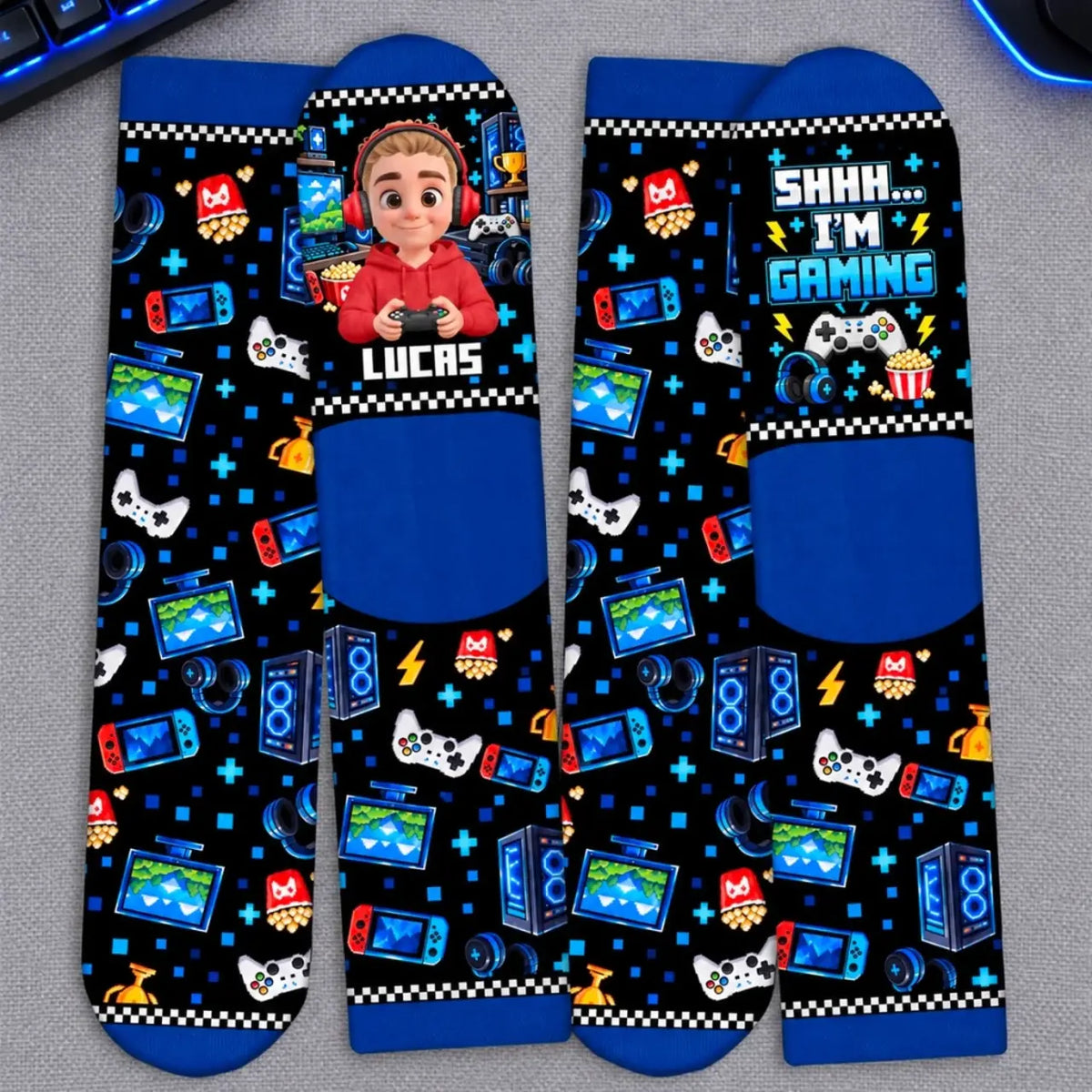Flat-lay gamer crew socks showing the personalized name design, heels and printed soles