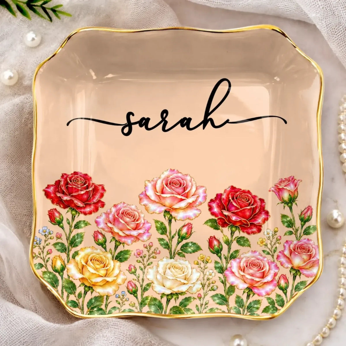 Scalloped peach jewelry dish with roses, a gold-tone border and the name Sarah