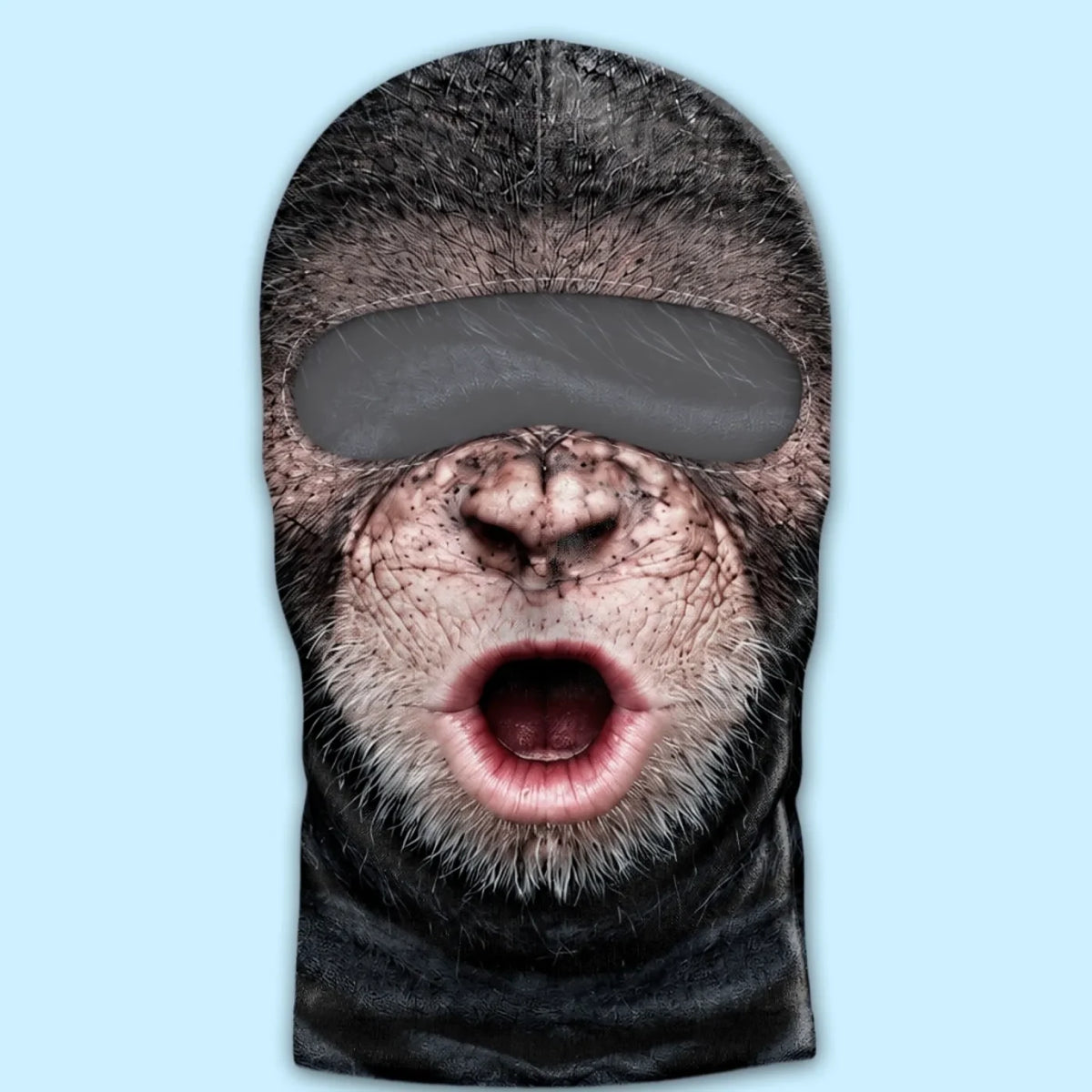 Surprised open-mouth monkey print balaclava laid flat, showing the eye opening.