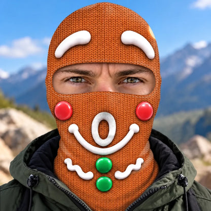 Front view of gingerbread-face Christmas print balaclava with an O-shaped mouth, red cheeks and two green buttons.