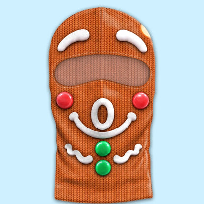 Gingerbread O-mouth print balaclava laid flat with white icing artwork, red cheeks, two green buttons and an eye opening.