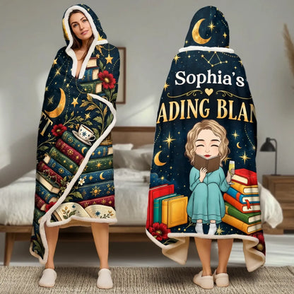 Front and back of celestial reading hooded blanket worn by an adult