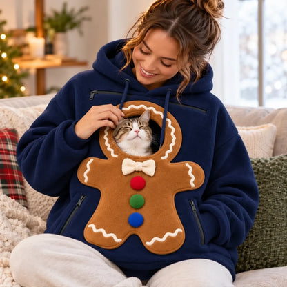 Blue gingerbread pouch hoodie shown seated with a cat