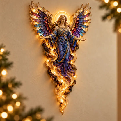 Gabriel angel wall sculpture with open palms, jewel-toned wings and a warm halo in a softly lit Christmas setting