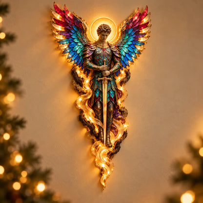Michael angel wall sculpture holding a downward sword, with jewel-toned wings and warm Christmas light