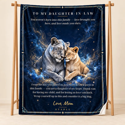 Illustrative studio mockup of To My Daughter-in-Law velveteen blanket with Love, Mom message, on wooden stand with white reverse corner.