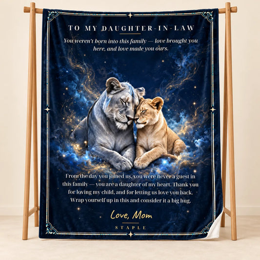 Illustrative studio mockup of To My Daughter-in-Law velveteen blanket with Love, Mom message, on wooden stand with white reverse corner.