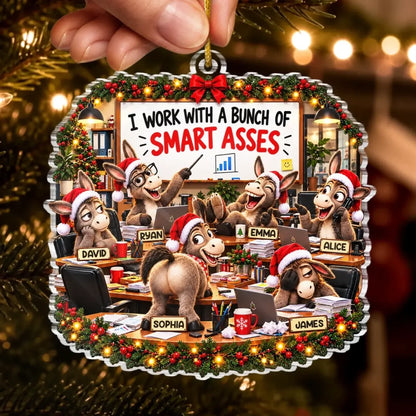 Hand holding a donkey coworker Christmas ornament with named characters, desks and holiday garlands.