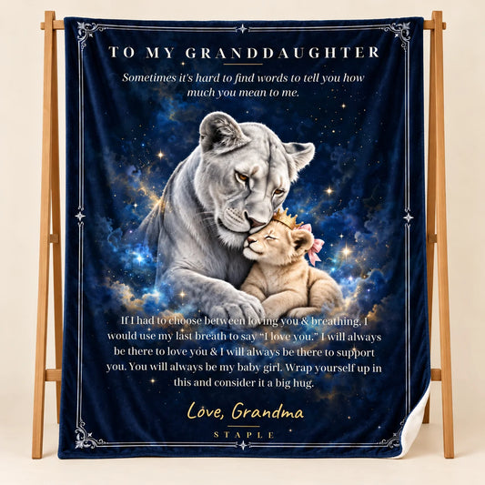 Illustrative studio mockup of To My Granddaughter velveteen blanket with Love, Grandma message, on wooden stand with white reverse corner.