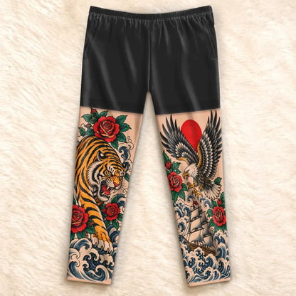 Flat front view of tiger and eagle tattoo-print pajama pants