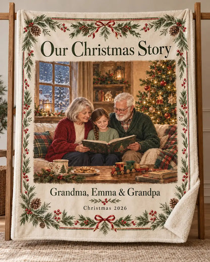 Illustrative design preview. Full-view Our Christmas Story sherpa blanket on a stand, with the sample family picture of Grandma, Emma and Grandpa and Christmas 2026.