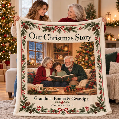 Illustrative design preview. Adult gift-giving scene with two women holding the Our Christmas Story blanket, personalized with the sample name Emma and Christmas 2026.
