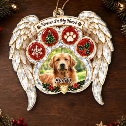Angel wing pet memorial ornament with a dog photo, Buddy name and holiday details on a wooden background.