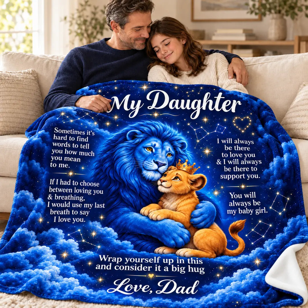 Illustrative father-and-adult-daughter scene with the celestial cartoon lion blanket across their laps, showing the blue father lion, golden crowned cub and Love, Dad message.