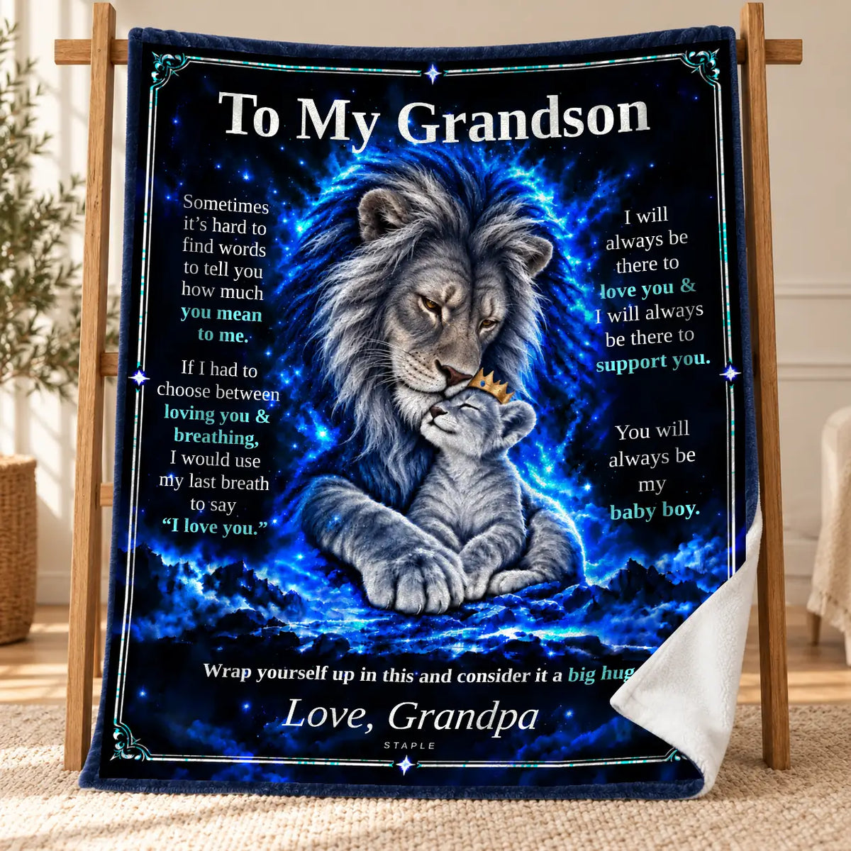 Original Blue To My Grandson Blue Lion blanket from Grandpa displayed on a wooden stand, with a curled corner showing its white velveteen reverse.