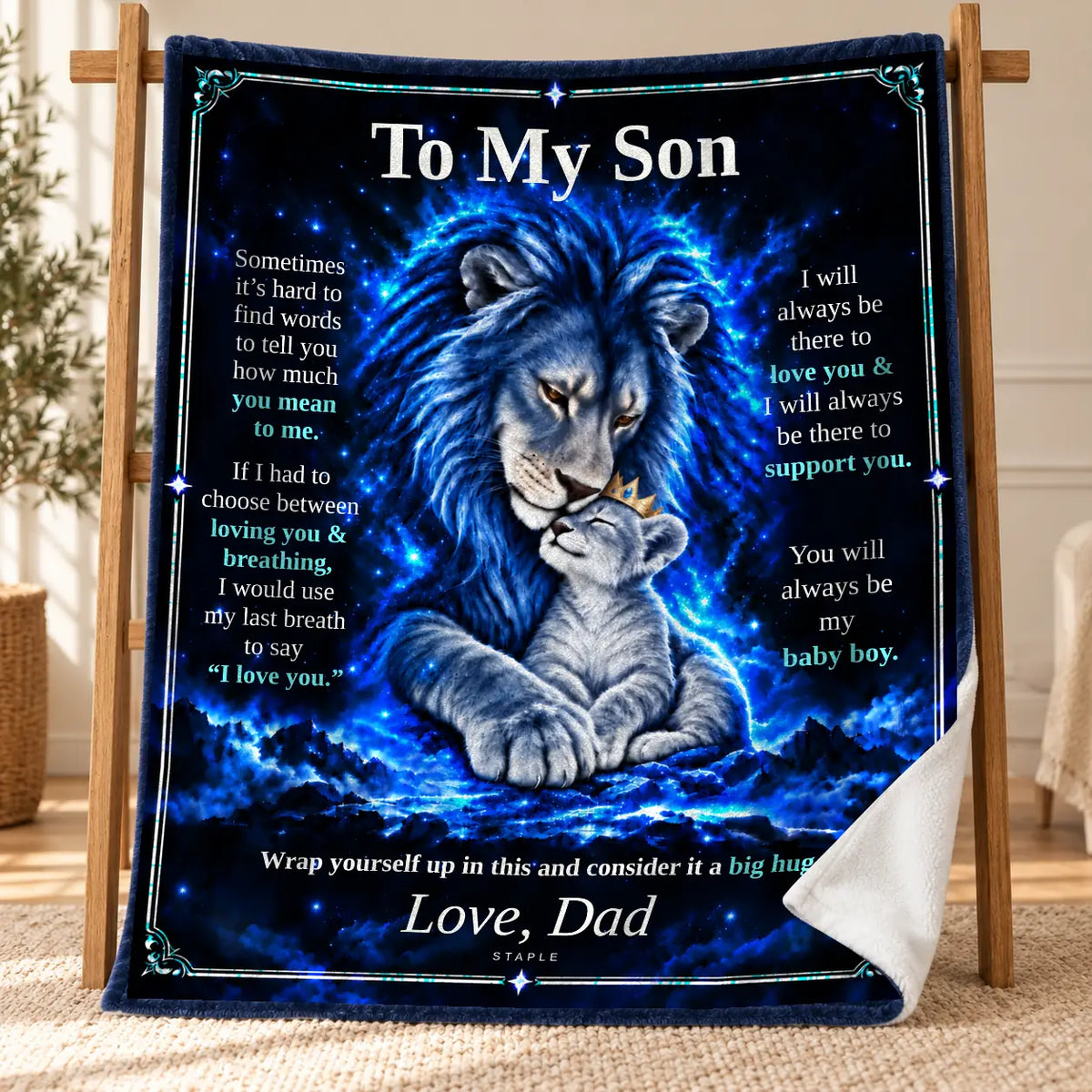 Original Blue To My Son Blue Lion blanket from Dad displayed on a wooden stand, with a curled corner showing its white velveteen reverse.