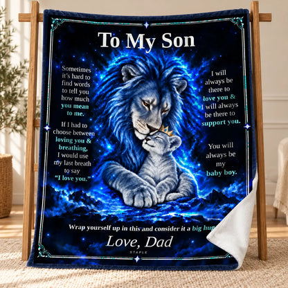 Original Blue To My Son Blue Lion blanket from Dad displayed on a wooden stand, with a curled corner showing its white velveteen reverse.