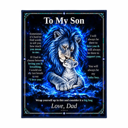 Illustrative studio mockup: To My Son lion blanket displayed against a white studio background, showing the Original Blue artwork and Love, Dad signature.